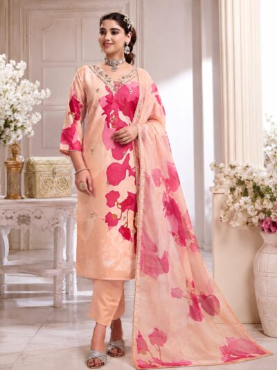 Woman wearing a peach chiffon 3 piece kurti set with a pink watercolour floral print, mirror work neckline and matching printed dupatta