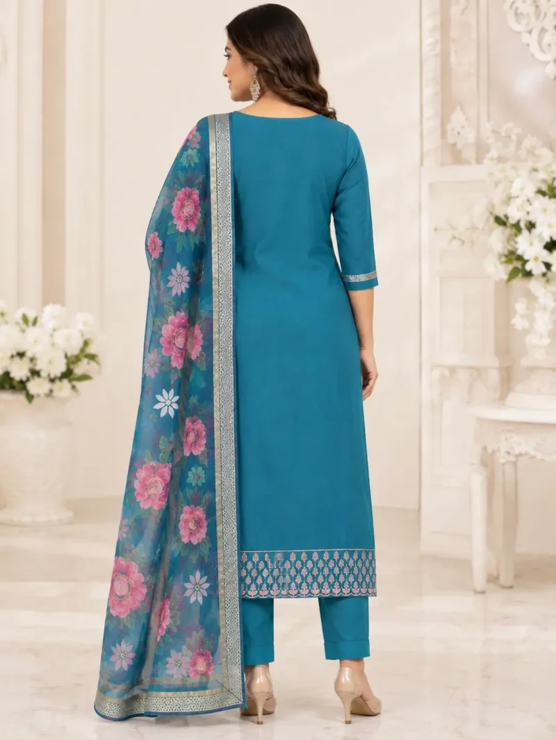 The outfit is teal blue peacock blue. 1