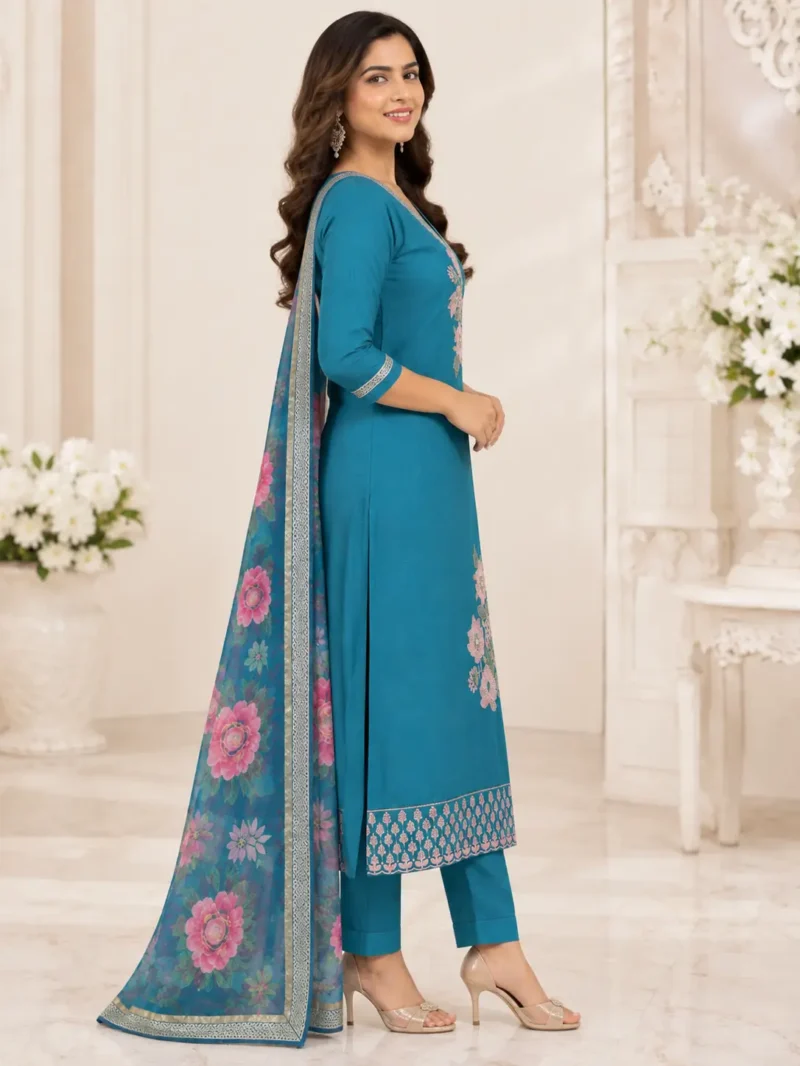 The outfit is teal blue peacock blue. 1