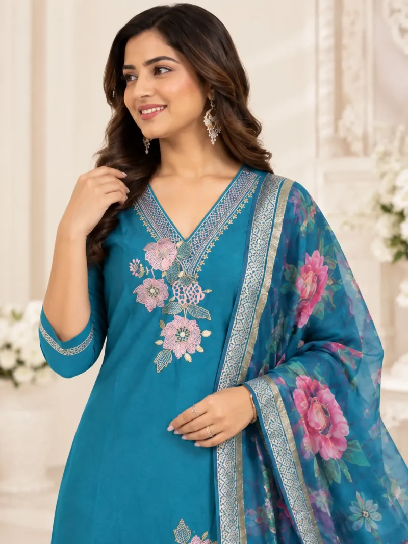 The outfit is teal blue peacock blue. 1